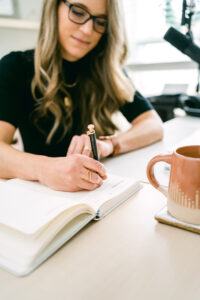 Image of Laura Schoenfeld writing used in blog about The Real Reason Your Content Isn’t Converting (And How To Fix It)