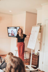 Image of Laura Schoenfeld teaching used for blog about Scaling Your Online Coaching Business