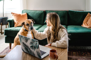 Photo of Laura with pet dog used for blog about how to make sales feel natural for health entrepreneurs